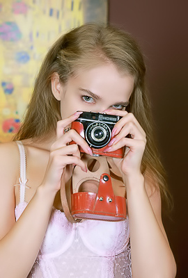 Xenia Glancing Back Over Her Shoulder With A Flirtatious Smile