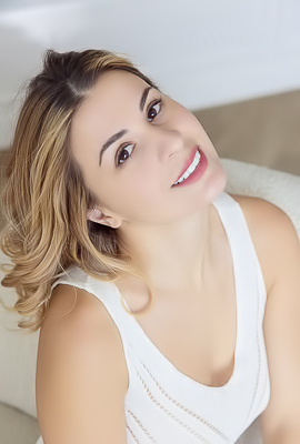 Alice Kelly Dark-eyed Siren Smiles Enticingly As The Straps Slide From Her Shoulders